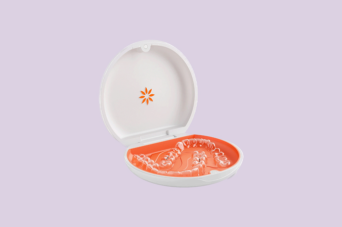 close up of clear vivera retainer on purple background