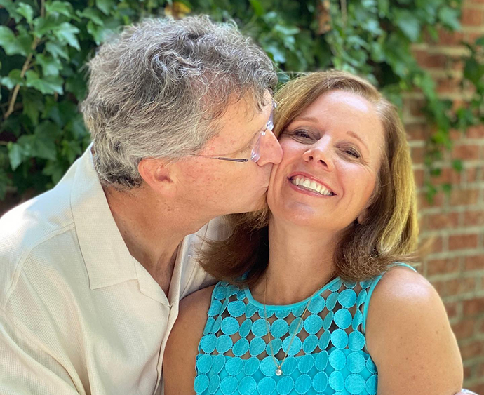Dr Vinson kissing his wife on the cheek
