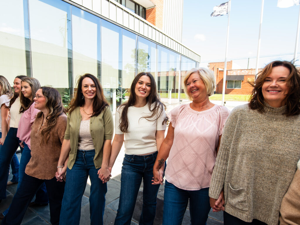 Joy Orthodontics Team Holding Hands