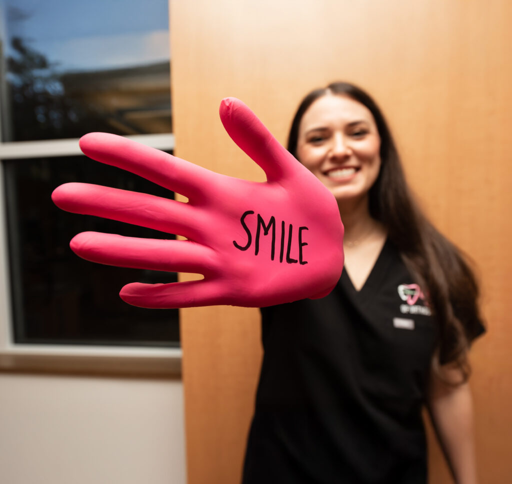 Dr Joy Showing Her Hand That Says Smile